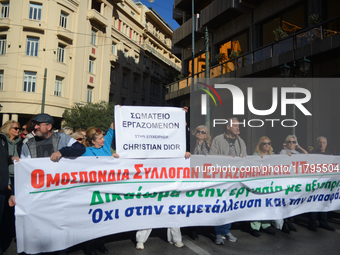 People demonstrate in the streets of Athens, Greece, on November 20, 2024, during a 24-hour nationwide strike called by unions against the r...