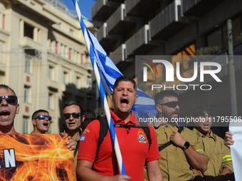 Firefighters demonstrate in the streets of Athens, Greece, on November 20, 2024, during a 24-hour nationwide strike organized by GSEE and AD...