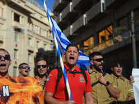 Firefighters demonstrate in the streets of Athens, Greece, on November 20, 2024, during a 24-hour nationwide strike organized by GSEE and AD...