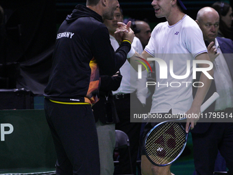 MALAGA, SPAIN - NOVEMBER 20: Daniel Altmaier of Team Germany celebrates the victory with his Captain after his singles match against Gabriel...