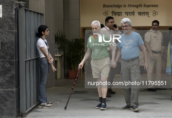 Indian voters come out after casting their ballots during the Maharashtra state assembly elections at a polling booth in Mumbai, India, on N...