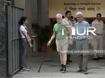 Indian voters come out after casting their ballots during the Maharashtra state assembly elections at a polling booth in Mumbai, India, on N...