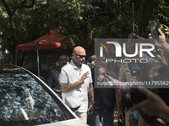 Rakesh Roshan, Indian film producer and director, enters a polling booth to cast his ballot during the Maharashtra state assembly elections...