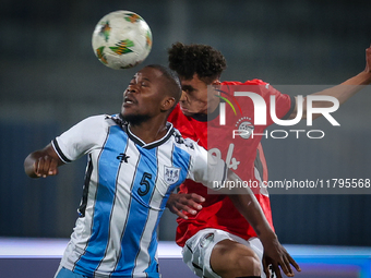 24 Zalaka of the Egypt team battles for possession with 5 Ricky Ratlhogo of the Botswana team during the Africa Cup of Nations Qualifiers ma...