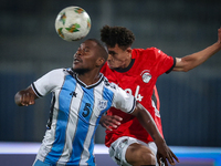 24 Zalaka of the Egypt team battles for possession with 5 Ricky Ratlhogo of the Botswana team during the Africa Cup of Nations Qualifiers ma...