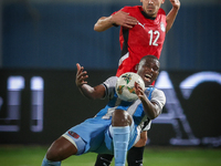 Mohamed Hamdi of the Egypt team battles for possession with Tumisang Orebonye of the Botswana team during the Africa Cup of Nations Qualifie...