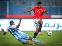 Ibrahim Adel of the Egypt team battles for possession with Lebogang Ditsele of the Botswana team during the Africa Cup of Nations Qualifiers...