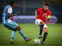 Mahmoud Trezeguet of the Egypt team battles for possession with Lebogang Ditsele of the Botswana team during the Africa Cup of Nations Quali...