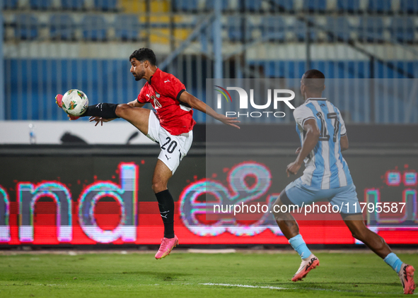 Ibrahim Adel of the Egypt team battles for possession with Chicco Molefe of the Botswana team during the Africa Cup of Nations Qualifiers ma...