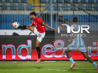 Ibrahim Adel of the Egypt team battles for possession with Chicco Molefe of the Botswana team during the Africa Cup of Nations Qualifiers ma...