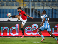 Ibrahim Adel of the Egypt team battles for possession with Chicco Molefe of the Botswana team during the Africa Cup of Nations Qualifiers ma...