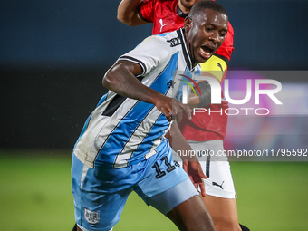 Mahmoud Trezeguet of the Egypt team battles for possession with Tumisang Orebonye of the Botswana team during the Africa Cup of Nations Qual...