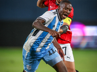 Mahmoud Trezeguet of the Egypt team battles for possession with Tumisang Orebonye of the Botswana team during the Africa Cup of Nations Qual...