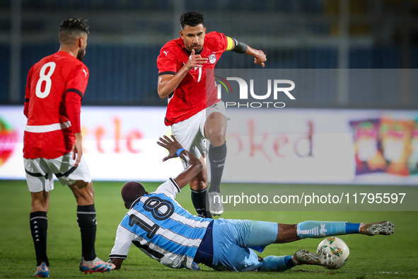 Mahmoud Trezeguet of the Egypt team battles for possession with Lebogang Ditsele of the Botswana team during the Africa Cup of Nations Quali...