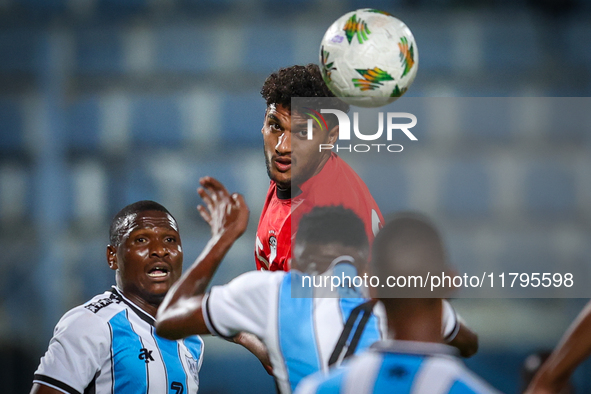 Osama Faisal of the Egypt team battles for possession with Thatayaone Ditlhokwe of the Botswana team during the Africa Cup of Nations Qualif...