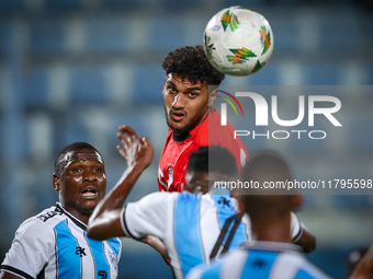 Osama Faisal of the Egypt team battles for possession with Thatayaone Ditlhokwe of the Botswana team during the Africa Cup of Nations Qualif...