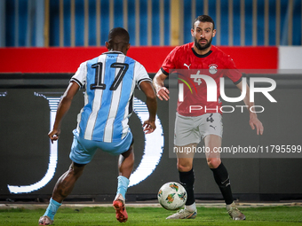 Omar Kamal of the Egypt team battles for possession with Chicco Molefe of the Botswana team during the Africa Cup of Nations Qualifiers matc...