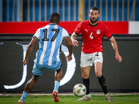 Omar Kamal of the Egypt team battles for possession with Chicco Molefe of the Botswana team during the Africa Cup of Nations Qualifiers matc...