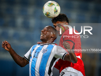 Hossam Abdelmaguid of the Egypt team battles for possession with Tumisang Orebonye of the Botswana team during the Africa Cup of Nations Qua...