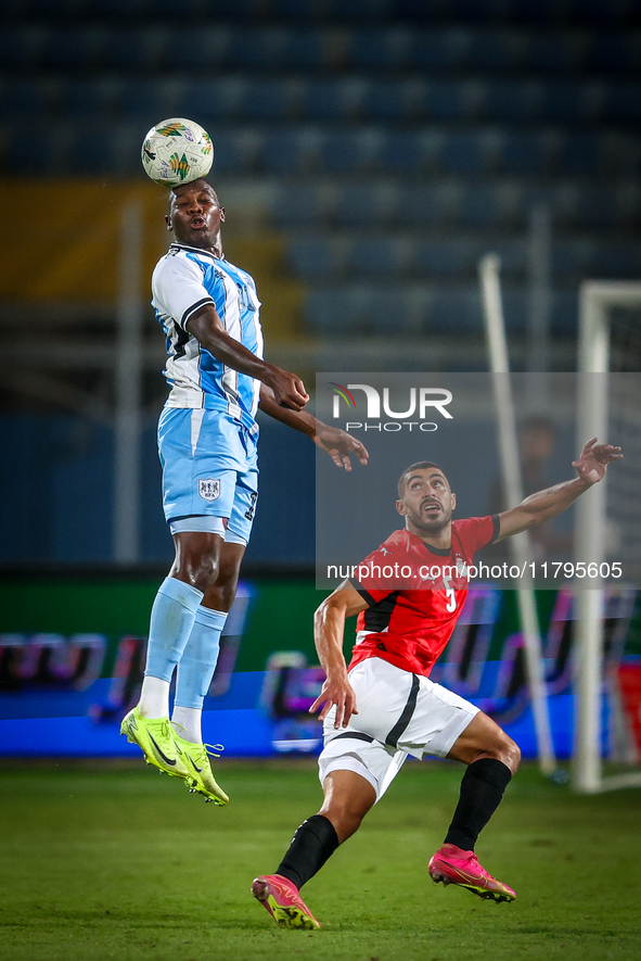 Mohamed Youssef of the Egypt team battles for possession with Tumisang Orebonye of the Botswana team during the Africa Cup of Nations Qualif...