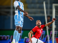 Mohamed Youssef of the Egypt team battles for possession with Tumisang Orebonye of the Botswana team during the Africa Cup of Nations Qualif...