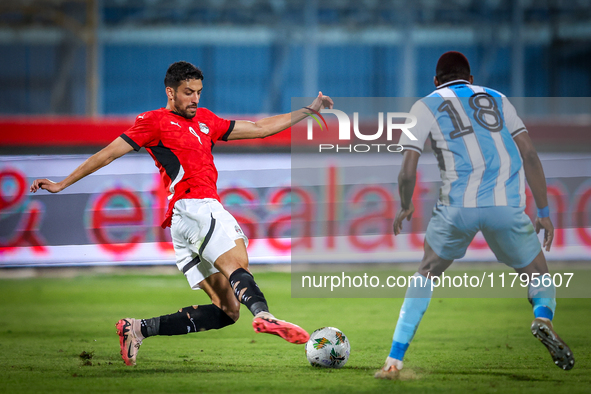 Taher Mohamed of the Egypt team battles for possession with Lebogang Ditsele of the Botswana team during the Africa Cup of Nations Qualifier...