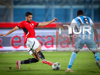 Taher Mohamed of the Egypt team battles for possession with Lebogang Ditsele of the Botswana team during the Africa Cup of Nations Qualifier...