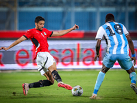 Taher Mohamed of the Egypt team battles for possession with Lebogang Ditsele of the Botswana team during the Africa Cup of Nations Qualifier...