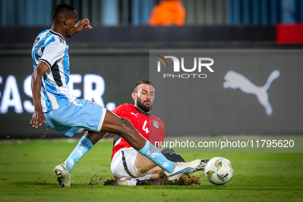 Omar Kamal of the Egypt team battles for possession with Koketso Majafi of the Botswana team during the Africa Cup of Nations Qualifiers mat...