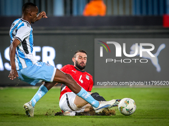 Omar Kamal of the Egypt team battles for possession with Koketso Majafi of the Botswana team during the Africa Cup of Nations Qualifiers mat...