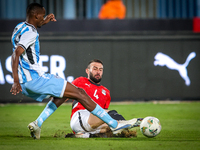 Omar Kamal of the Egypt team battles for possession with Koketso Majafi of the Botswana team during the Africa Cup of Nations Qualifiers mat...