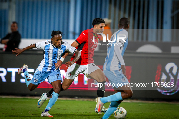 Omar Marmoush of the Egypt team battles for possession with Kabelo Seakanyeng of the Botswana team during the Africa Cup of Nations Qualifie...