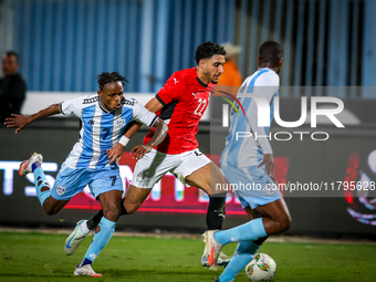 Omar Marmoush of the Egypt team battles for possession with Kabelo Seakanyeng of the Botswana team during the Africa Cup of Nations Qualifie...