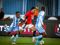 Omar Marmoush of the Egypt team battles for possession with Kabelo Seakanyeng of the Botswana team during the Africa Cup of Nations Qualifie...