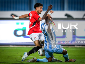 Omar Marmoush of the Egypt team battles for possession with Olebogeng Ramotse of the Botswana team during the Africa Cup of Nations Qualifie...