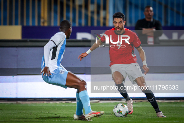 Taher Mohamed of the Egypt team battles for possession with Thabo Leinanyane of the Botswana team during the Africa Cup of Nations Qualifier...