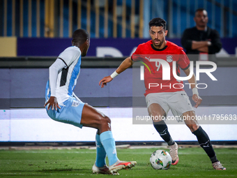 Taher Mohamed of the Egypt team battles for possession with Thabo Leinanyane of the Botswana team during the Africa Cup of Nations Qualifier...