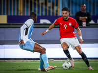 Taher Mohamed of the Egypt team battles for possession with Thabo Leinanyane of the Botswana team during the Africa Cup of Nations Qualifier...