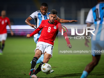 Nasser Maher of the Egypt team battles for possession with Omaatla Kebatho of the Botswana team during the Africa Cup of Nations Qualifiers...