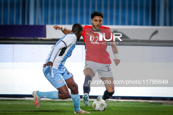 Omar Marmoush of the Egypt team battles for possession with Thabo Leinanyane of the Botswana team during the Africa Cup of Nations Qualifier...