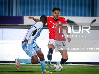 Omar Marmoush of the Egypt team battles for possession with Thabo Leinanyane of the Botswana team during the Africa Cup of Nations Qualifier...