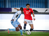 Omar Marmoush of the Egypt team battles for possession with Thabo Leinanyane of the Botswana team during the Africa Cup of Nations Qualifier...