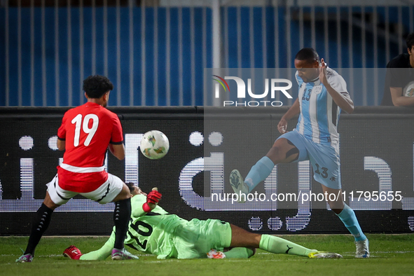 Mostafa Shobeir of the Egypt team battles for possession with Omaatla Kebatho of the Botswana team during the Africa Cup of Nations Qualifie...