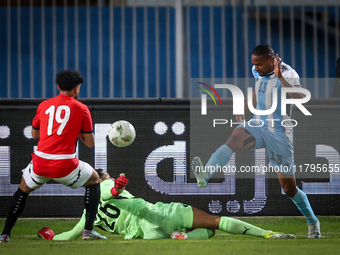 Mostafa Shobeir of the Egypt team battles for possession with Omaatla Kebatho of the Botswana team during the Africa Cup of Nations Qualifie...