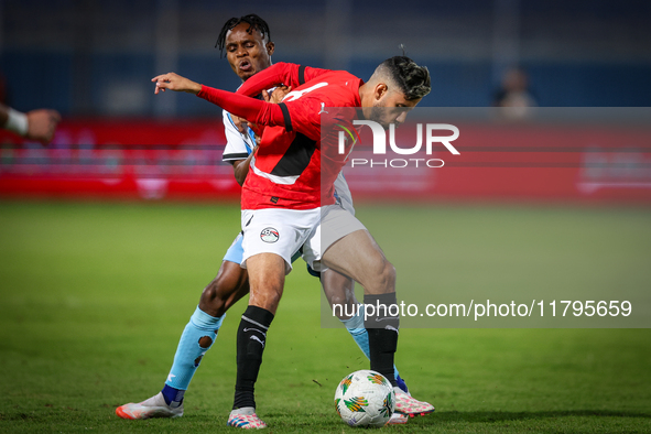 Nasser Maher of the Egypt team battles for possession with Kabelo Seakanyeng of the Botswana team during the Africa Cup of Nations Qualifier...