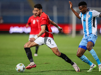 Taher Mohamed of the Egypt team battles for possession with Mosha Gaolaolwe of the Botswana team during the Africa Cup of Nations Qualifiers...