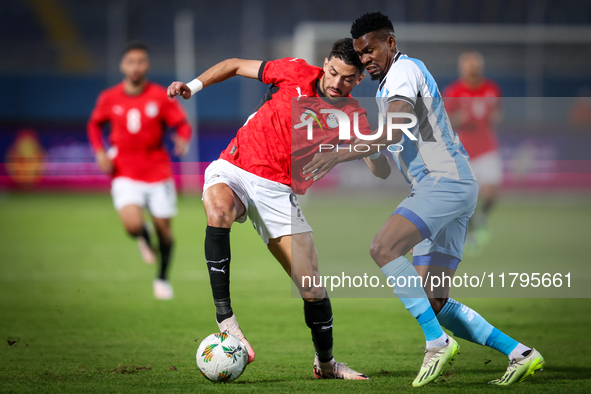 Taher Mohamed of the Egypt team battles for possession with Mosha Gaolaolwe of the Botswana team during the Africa Cup of Nations Qualifiers...