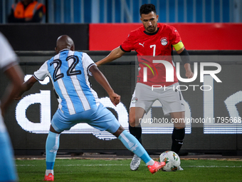 Omar Marmoush of the Egypt team battles for possession with Kabelo Seakanyeng of the Botswana team during the Africa Cup of Nations Qualifie...