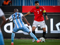 Omar Marmoush of the Egypt team battles for possession with Kabelo Seakanyeng of the Botswana team during the Africa Cup of Nations Qualifie...