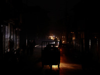 Vehicles move on a cold winter evening in Sopore, Jammu and Kashmir, India, on November 20, 2024. (